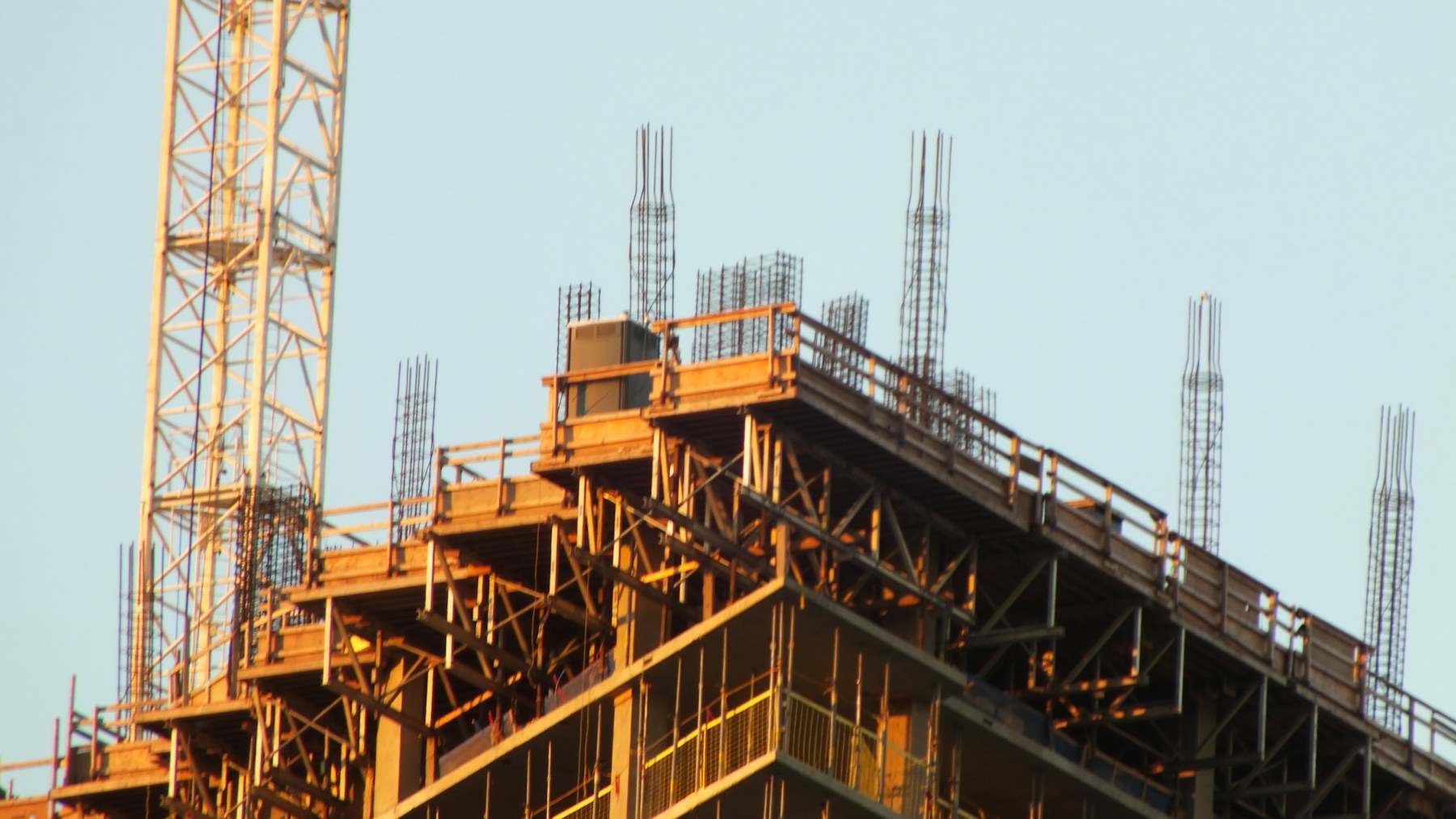 Tower crane and multi-storey structure under construction