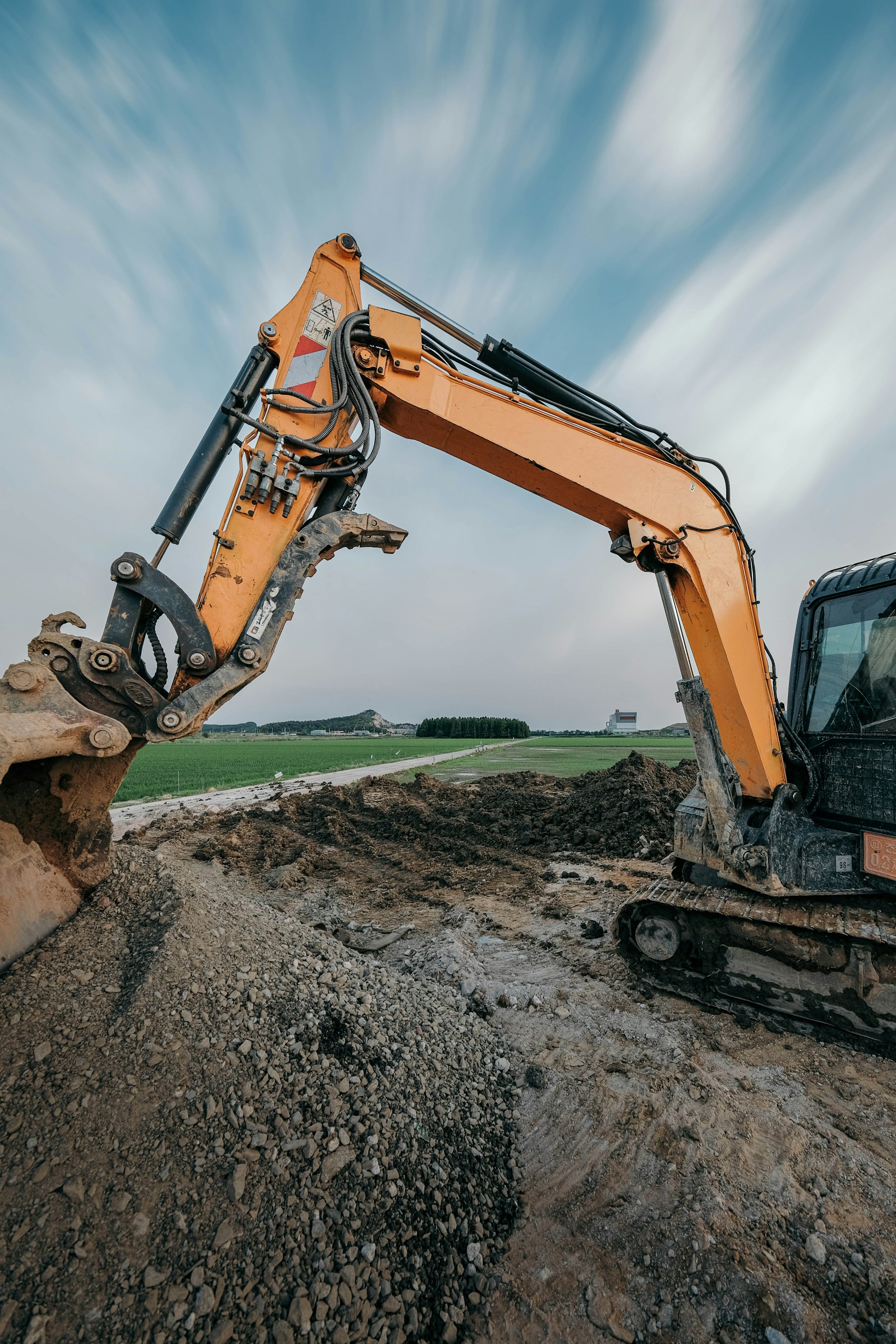 Heavy excavator working on an active earthworks site